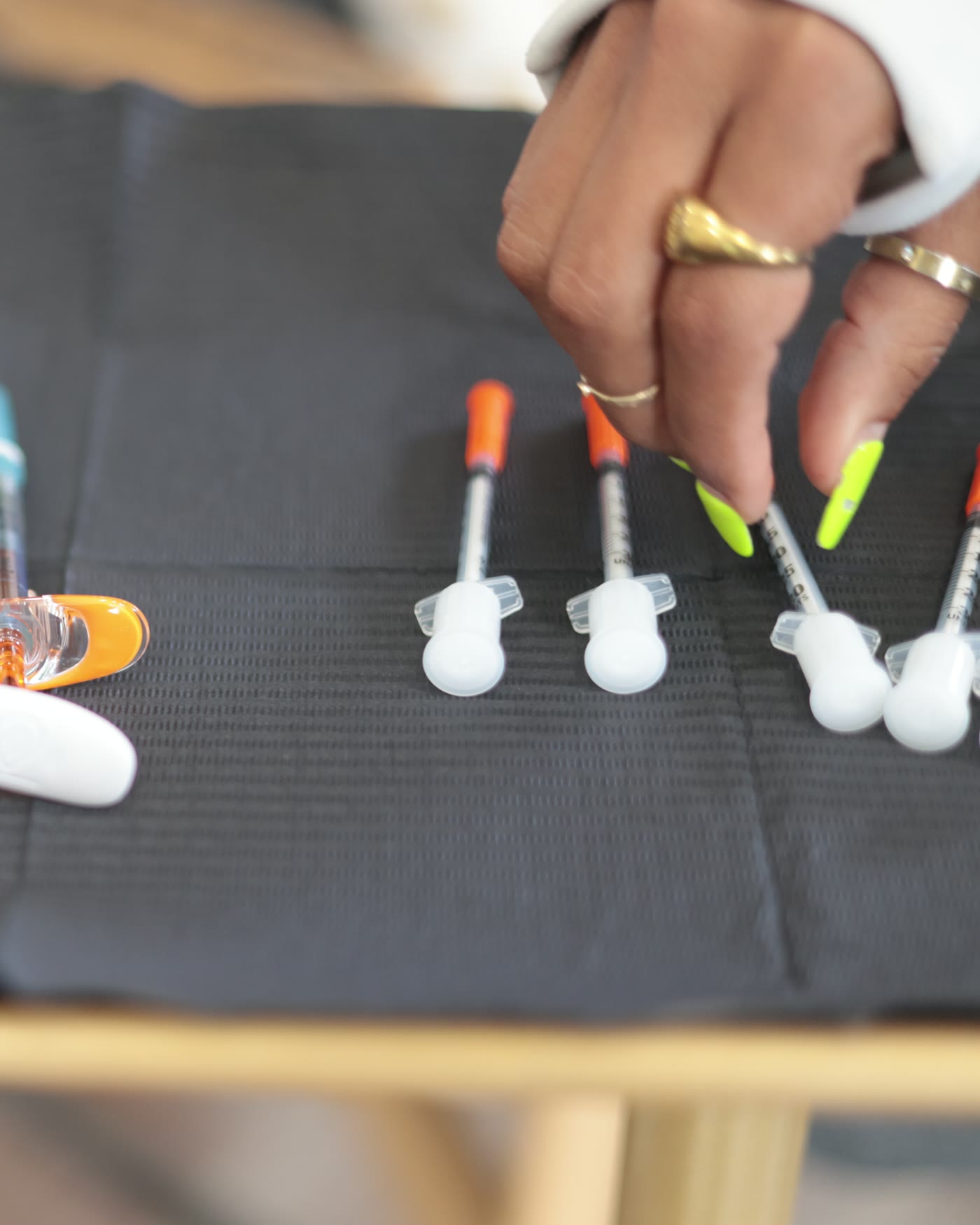 Brandy setting up a tray of pre-loaded syringes before a session